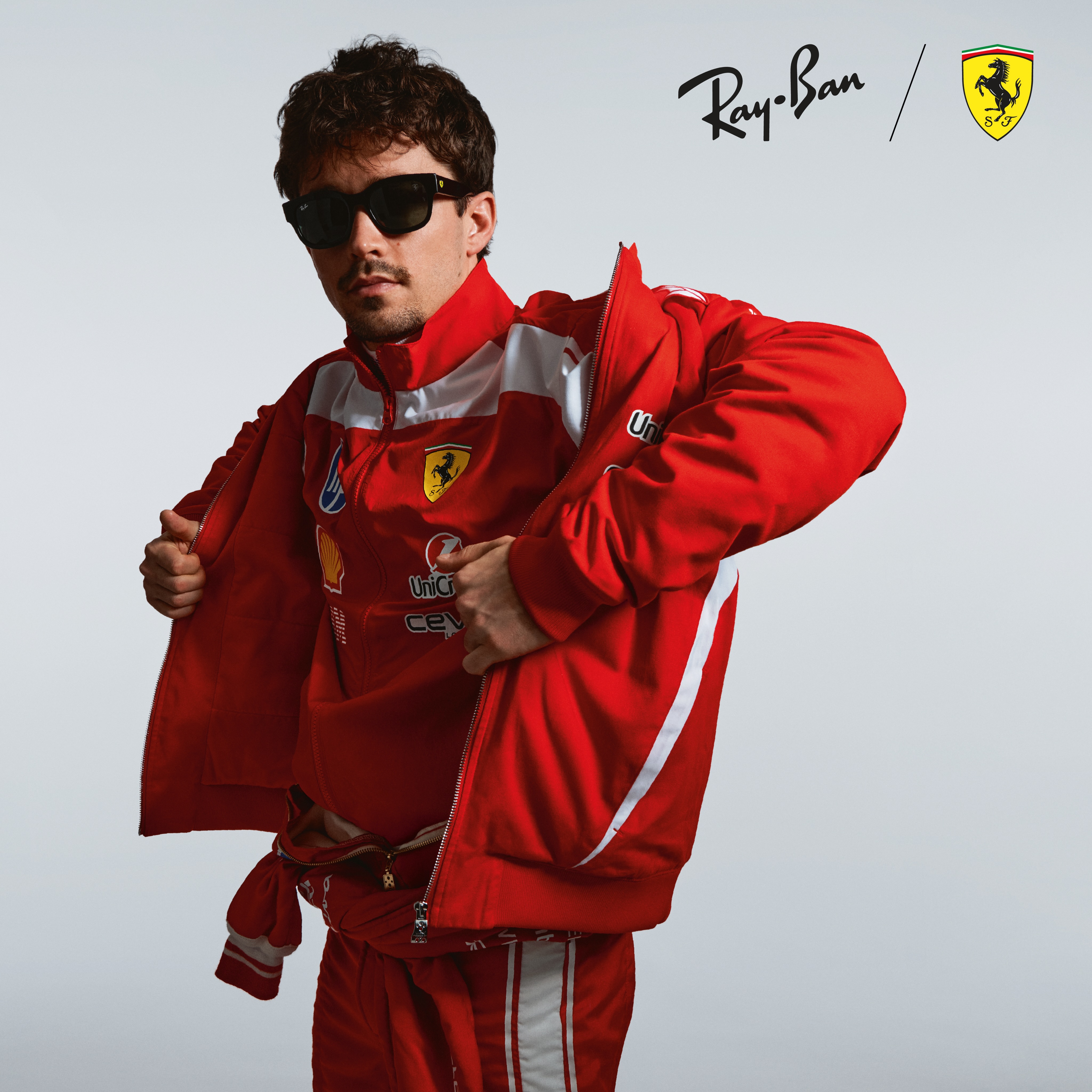 Rewrite the rules of style with a sleek acetate frame, finished with Scuderia Ferrari’s signature l…